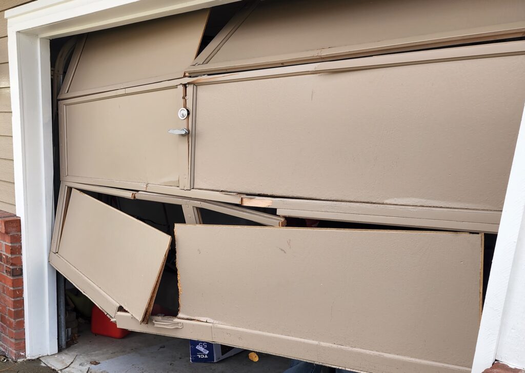 garage door damaged by vehicle