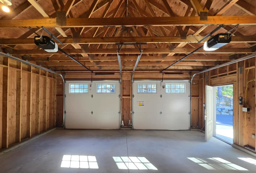 Spacious garage with two doors.