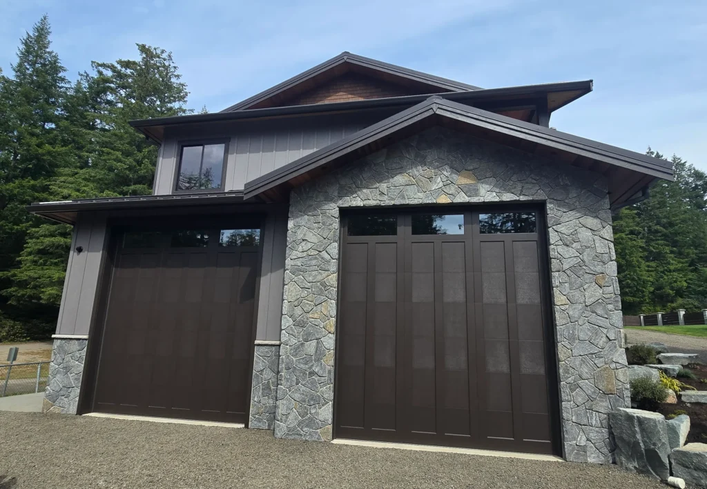 Modern garage doors with stone accents