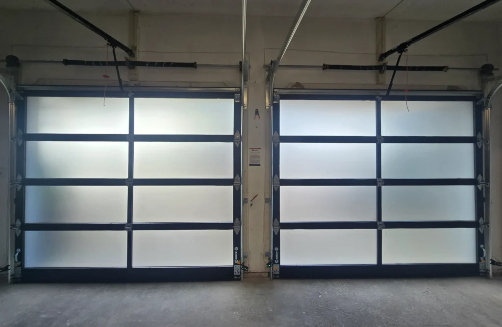 Two closed garage doors with windows